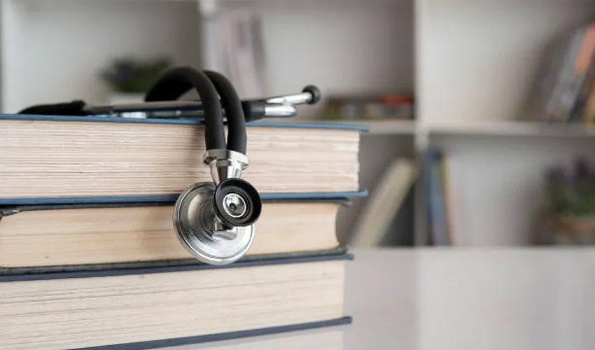 NEET 2027 study plan with medical books stethoscope and notes on a study desk